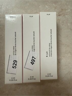 Glossier lip crème set in white and pink packaging